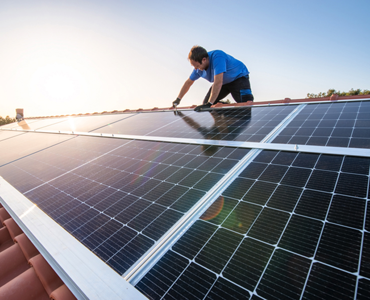 person installing solar panels