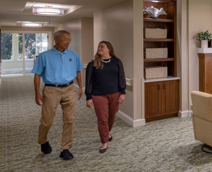 staff walking down hallway
